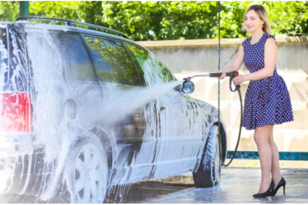 A clean car at a car wash near me paracoche.ovh with water and soap bubbles.